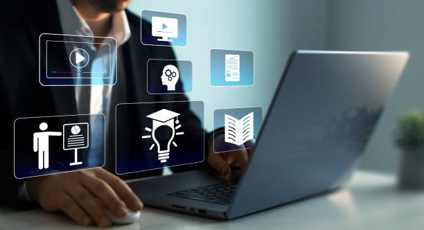 istock E-learning education.Digital internet lessons and online webinar on virtual screen. Education internet Technology.Business person who attends online lessons on a digital technology screen. 2166786833