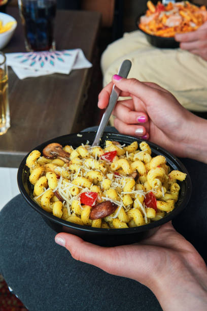 istock Eating Pasta Fresca Delivery Bowl 2166787821