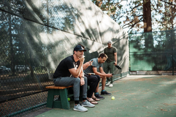 istock Group of men take a break while playing pickleball 2166789448