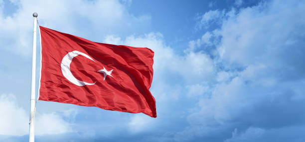 istock Turkish flag waving in the blue, cloudy sky. 2166791278