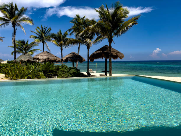 istock Pool, umbrellas and luxury Caribbean resort. 2166793399