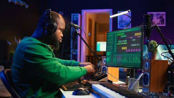 istock Skilled music producer composing new soundtracks on console and daw software 2166799646