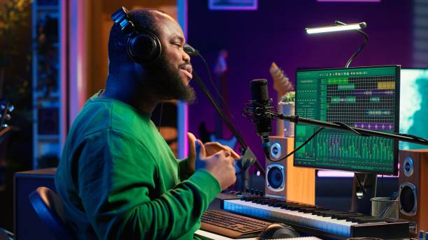 istock Artist composer recording a new track on his home studio microphone 2166800282