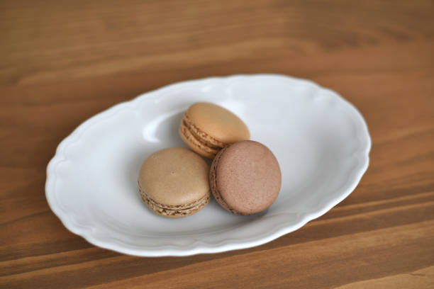 istock Three french macarons on a plate 2166800438