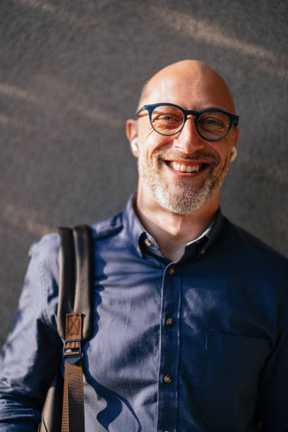 istock Confident Businessman Smiling Outdoors in Natural Light 2166802733