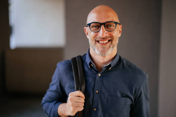 istock Confident Businessman Smiling in Casual Office Environment 2166802742