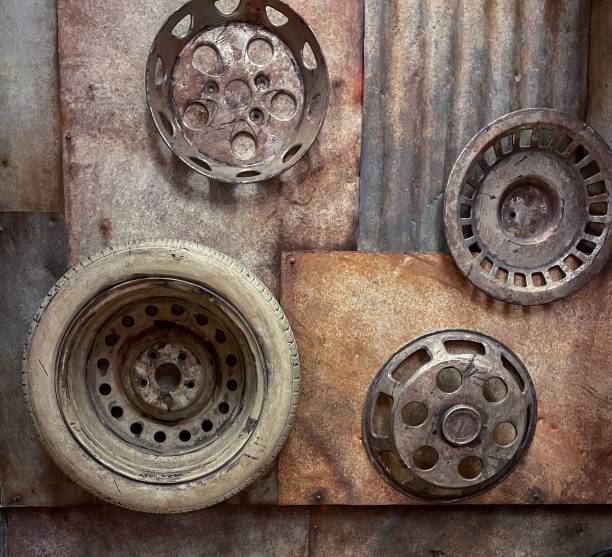 Rustic wall art made from old car wheels and metal sheets creating an industrial aesthetic