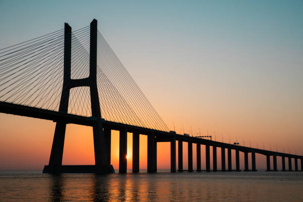 istock vasco da gama bridge sunrise photo 2166804988