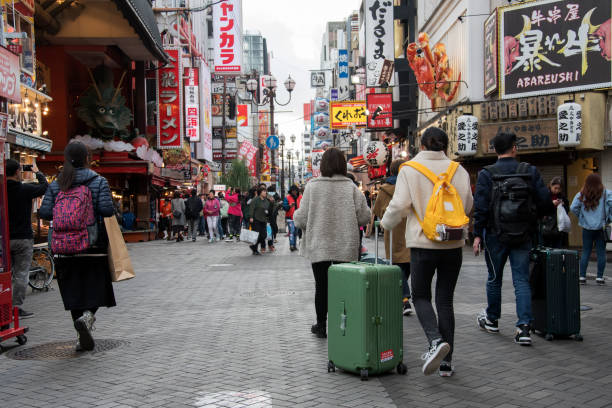 Osaka, Japan- 28 Nov, 2019: People visit Dotonbori street in Osaka, Japan. Dotonbori is the main entertainment area of Osaka.