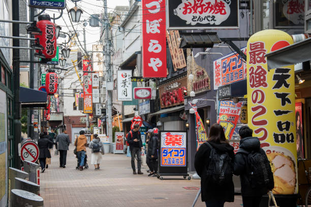 Osaka, Japan- 28 Nov, 2019: People visit Dotonbori street in Osaka, Japan. Dotonbori is the main entertainment area of Osaka.