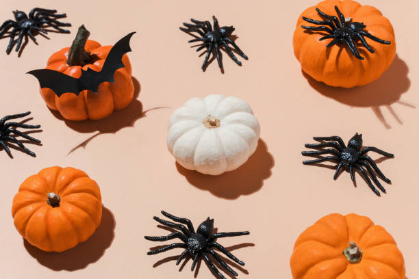 istock Halloween pattern with trendy hard shadows. Orange pumpkins and black spiders pattern on pastel background. Decoration for Halloween party. Copy space, blogs, promotions. 2166807063