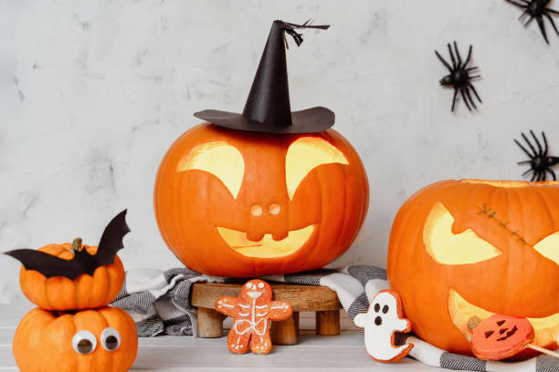 istock Halloween Jack-O'-Lanterns with Witch Hat and Festive Cookies 2166807212