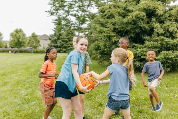 istock Dunking Dreams: Kids Enjoying Basketball Games 2166810516