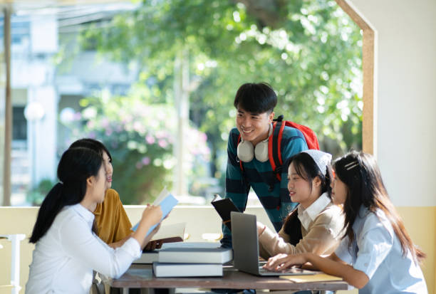 istock Group of students studying on campus outdoors 2166813263