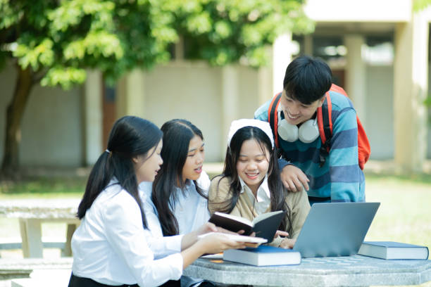istock Group of students studying on campus outdoors 2166813299