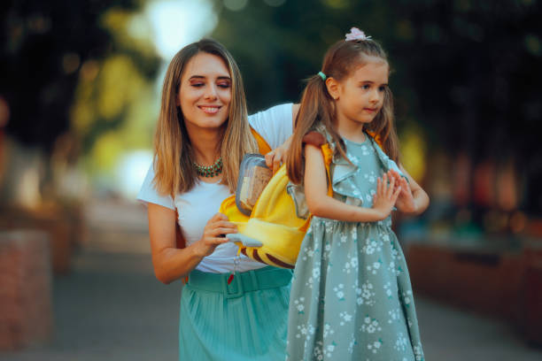 istock Mom Checking the Lunch Box is in the School Bag 2166814076
