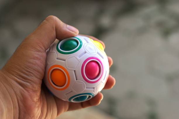istock A hand holding colorful toy ball 2166817116