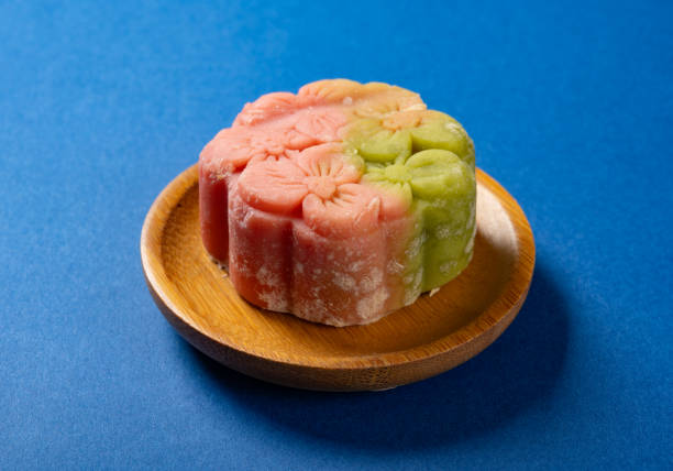 istock angle view moldy flower shape mooncake on blue background 2166819725