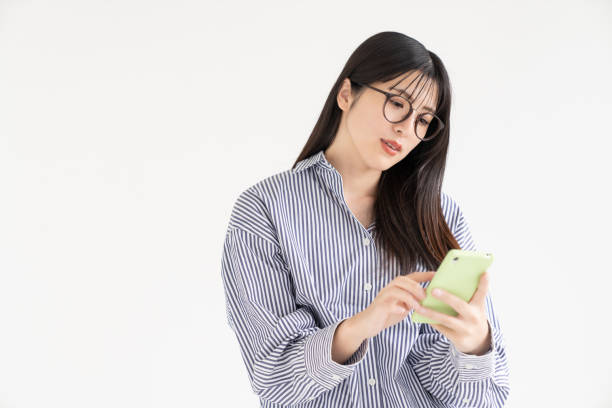 istock attractive Asian woman using a smart phone 2166819883