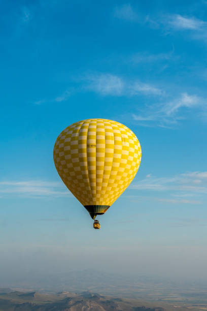 istock hot air balloon floating in the blue sky 2166820153
