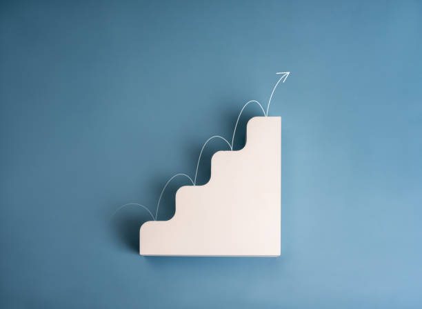 istock Business growth performance concept. White arrow jumping on modern white geometric stair 4 level steps as growing graph isolated on blue background. Simple 3d progress chart object minimalist design. 2166823121