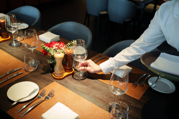 istock hand holding red wine glass 2166824389