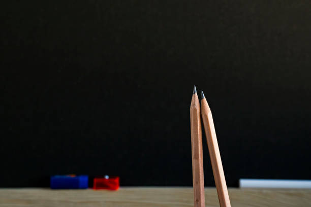 Attractive colored pencils on a blue background