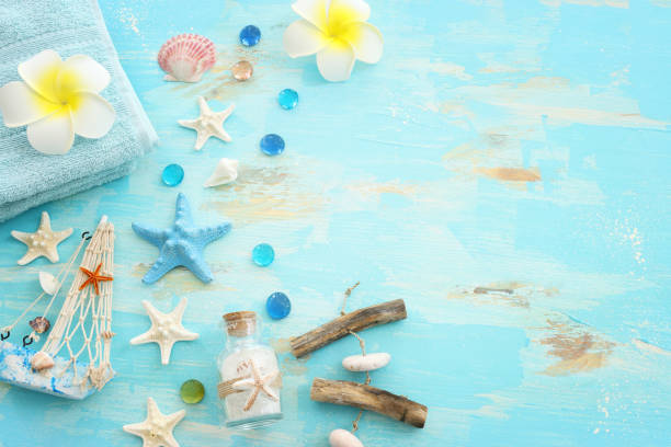 istock nautical concept with starfish and seashells over wooden blue background 2166830349