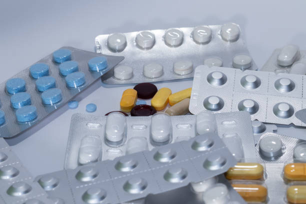 istock Multicolored pills scattered on whiteAssorted pills in vibrant colors 2166830772
