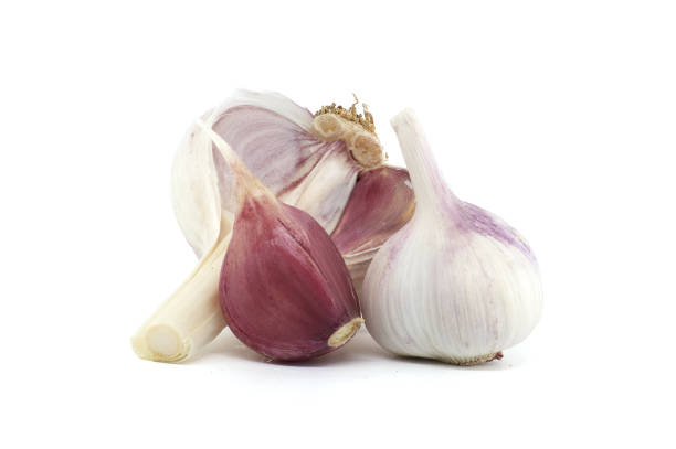 istock Garlic bulbs of varying sizes isolated on white background 2166831668