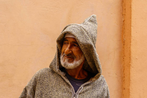 Close up portrait of a mature man over white wall, Daylight photo
