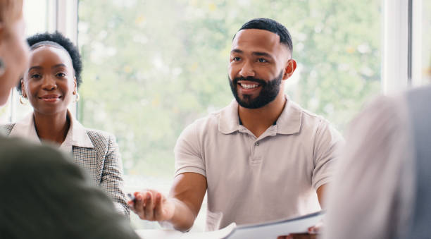istock People, ideas or strategy discussion in meeting for revenue information or organizing project. Happy, talking or company growth solution in office for startup business, teamwork or group planning 2166832925