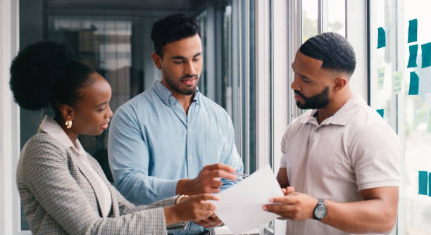 istock Paperwork, people or strategy on glass for brainstorming, reminder or organizing startup project. Solution, sticky notes or creative ideas in business meeting for timeline, teamwork or group planning 2166832961