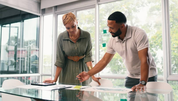 istock Business people, planning and conversation with teamwork, documents and advice for project launch. Employees, man and woman with paperwork, support and cooperation for ideas, talk and company growth 2166832964