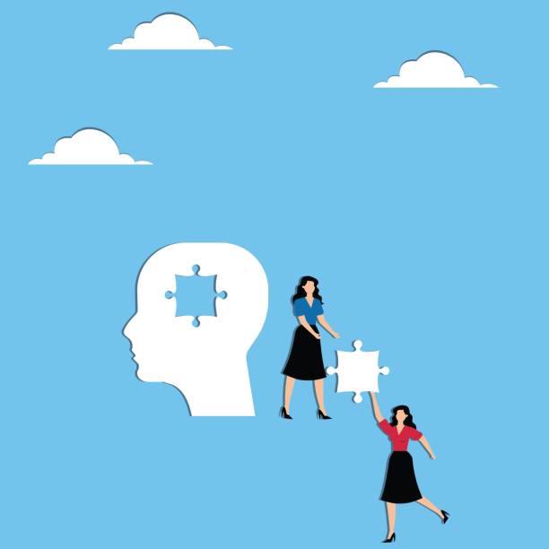 istock Two woman carry the missing puzzle to a big head 2166835714