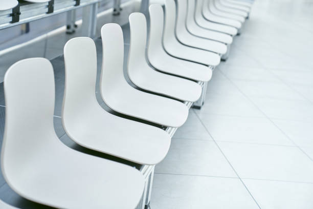 istock Empty white plastic chairs in the arena, a row of chairs with space to copy 2166836170