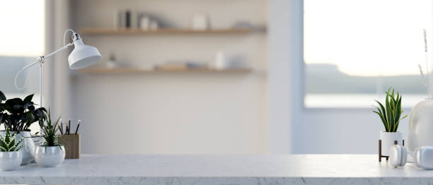 istock A copy space for displaying products on a white marble table in a minimalist white room. 2166836544