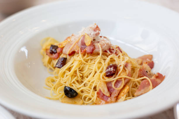 istock Spaghetti with Dried Chili, Black Olives, and Cheese 2166836599