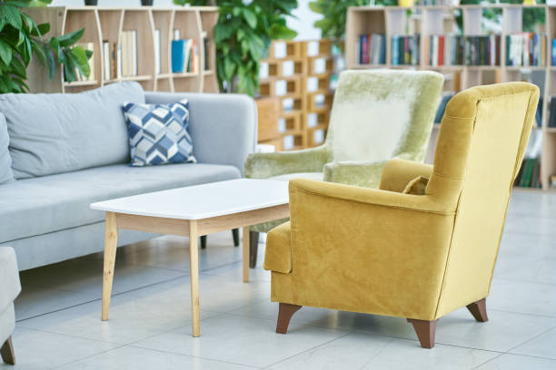 istock A bright, spacious room with a comfortable sofa and plants with space to copy. Modern interior design, in a spacious room, next to a table with flowers on a light background. 2166837841