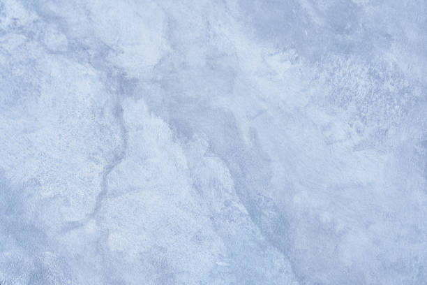 istock A blue background with a marble texture pattern in an elegant whimsical design, wavy curls and a curved marble pattern on a detailed white and pastel blue stone. Overlay for design. 2166838016