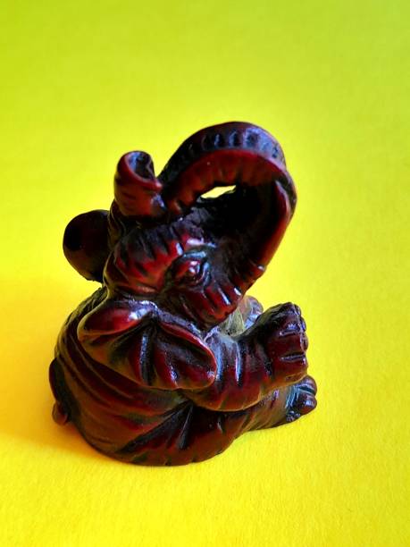 istock One lucky elephant isolated with yellow background 2166839851