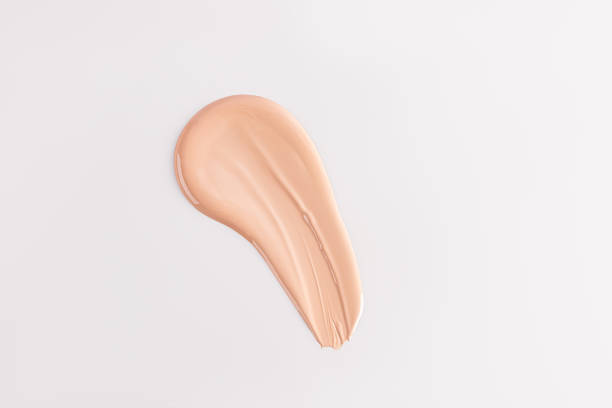 istock The texture of the foundation cream, a stroke on a white background. top view. A copy space. A sample of foundation. layout. template. 2166840548