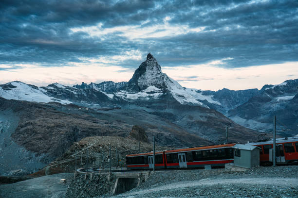 istock Electric train running on railway through Matterhorn mountain at Gornergrat station 2166840892
