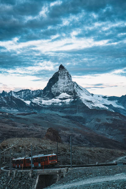 istock Electric train running on railway through Matterhorn mountain at Gornergrat station 2166840893