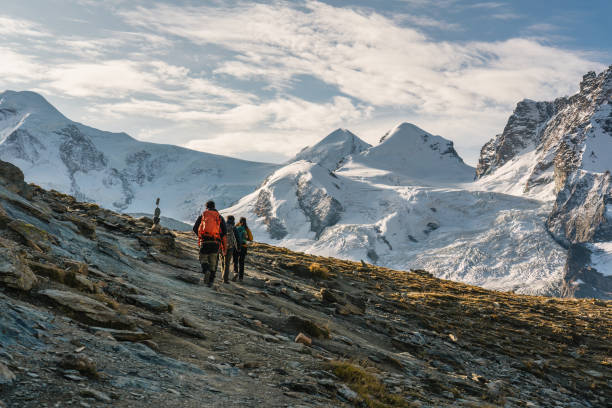 istock Group of backpacker hiking on alpine summit at Switzerland 2166840902
