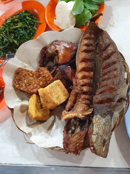 istock Fried fish and tempeh tofu and salad 2166841345