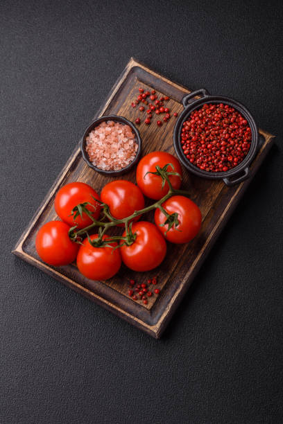 istock Juicy ripe red cherry tomatoes on a branch 2166841494