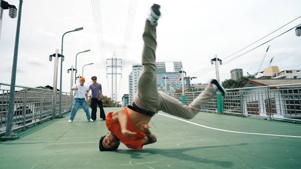 istock Young happy hipster perform break dancing or foot step with friend. Sprightly. 2166841550