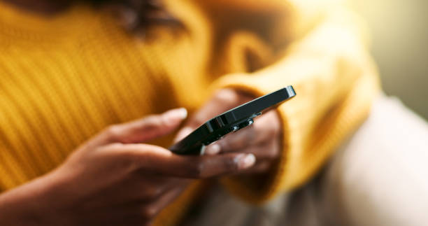 istock Hands, connection and using phone on sofa for scroll, typing and text message at home. Female person, network and mobile app for creating profile, chat and explore on dating website in living room 2166842001