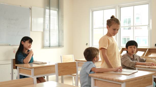 istock Diverse smart student raised hands to answer question at classroom. Pedagogy. 2166842668